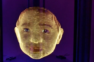 Light sculpture of face