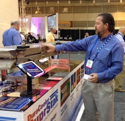 Duramax Marine's Mike Schonauer demonstrates the DuraCooler SuprStak keel cooler. Jessica Hathaway photo.