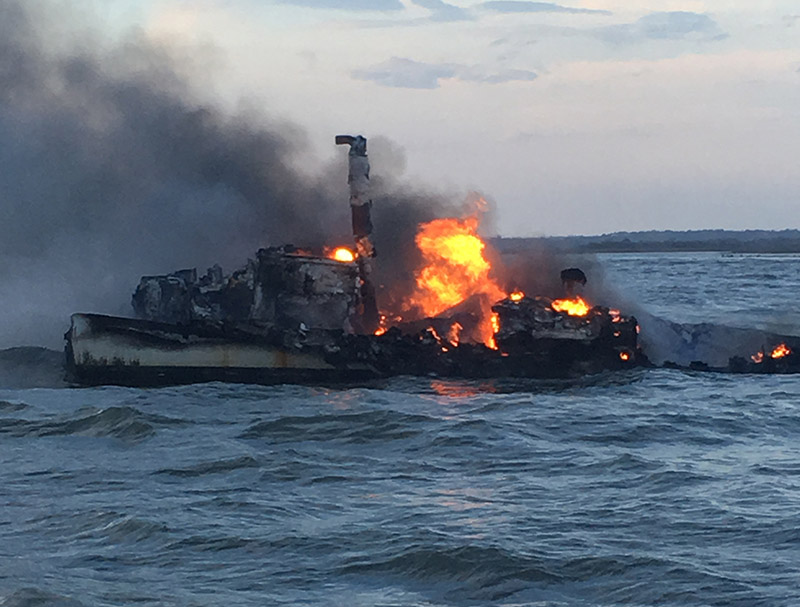 The Coast Guard rescued three fishermen Feb. 7, 2017, after their vessel caught fire 1 mile east of St. Catherines Island, Ga. USCG photo.