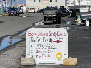 A sign directed customers toward curbside pickup of golden tilefish delivered by the Frances Anne April 8, 2020 at Lighthouse Marina in Barengat Light, NJ. Jeremy Muermann photo.