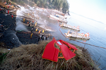 Navy boats anchored along the shoreline during the 1989 Exxon Valdez oil spill clean-up efforts in Alaska