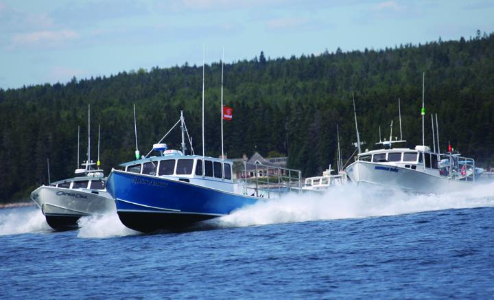 The Winter Harbor 2018 lobster boat races. The event this weekend features a brand new Mitchell Cove 35 bare hull in a prize drawing. Jon Johansen photo.