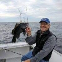 An angler with a black sea bass caught near the Block Island Wind Farm. Anglers for Offshore Wind Power photo.