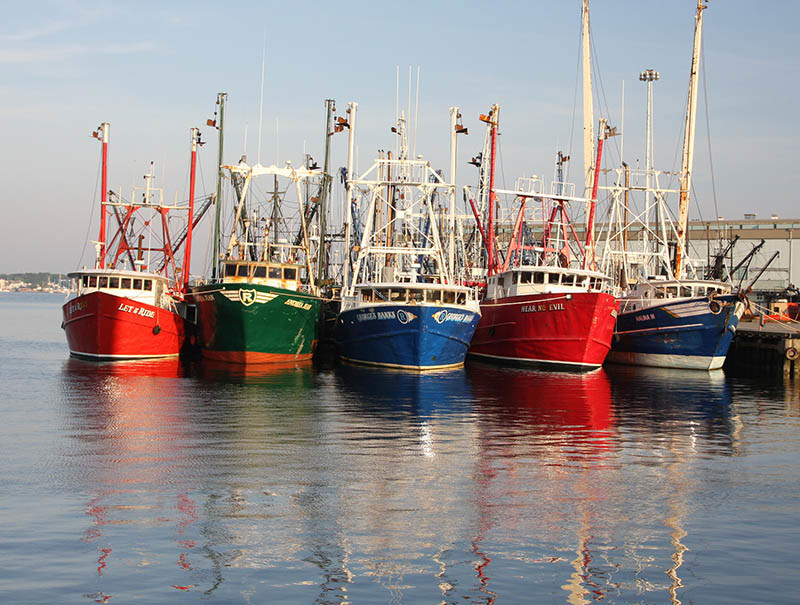 Fishing boats tied up in New Bedford. Massachusetts Office of Travel and Tourism photo.