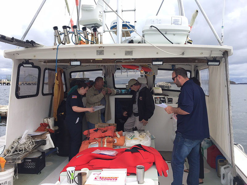 A U.S. Coast Guard commercial fishing vessel dockside safety exam in progress. Jessica Hathaway photo.