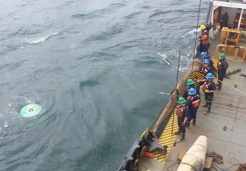 The crew of Coast Guard Cutter Ida Lewis observe a submerged buoy in the water off Block Island, R.I., on April 24, 2017. USCG photo by Chief Warrant Officer 3 Patrick Morkis.