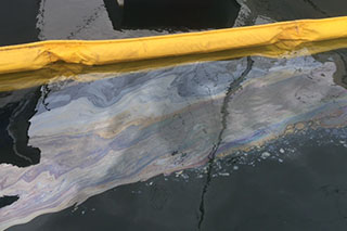 Sheen on the water from fuel spilled from the Istra Ace. California Department of Fish and Wildlife photo.
