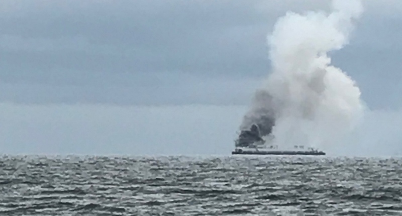 Coast Guard, partner agencies respond to adrift burning barge