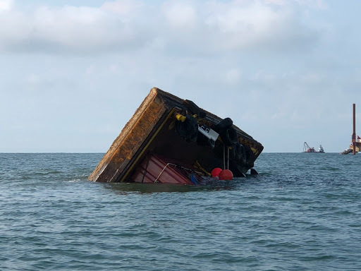 Coast Guard responds to capsized barge near Surfside Beach