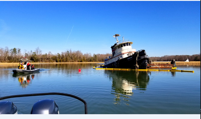 Coast Guard oversees pollution cleanup from submerged tugboat