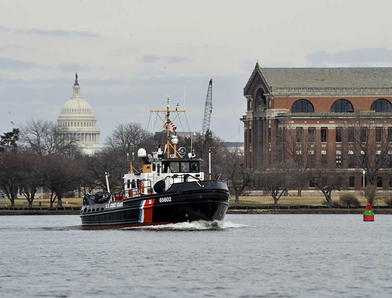 Crewmembers aboard the Coast Guard Cutter Chock enforce a security zone for the 58th Presidential Inauguration