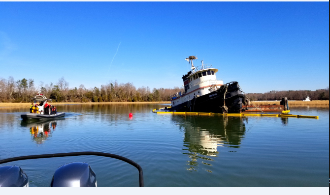 Coast Guard oversees pollution cleanup from submerged tugboat
