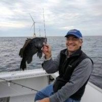 An angler with a black sea bass caught near the Block Island Wind Farm in Rhode Island. Anglers for Offshore Wind Power photo